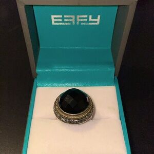 EFFY ring shaped with a black crater appearing dome look.